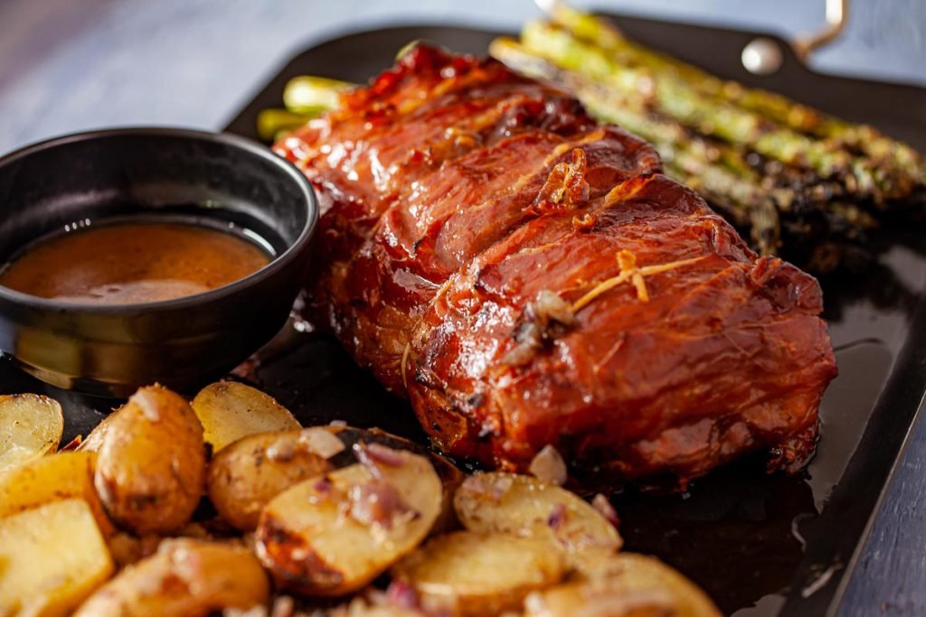 Prosciutto-Wrapped Grilled Pork Loin with Grilled Potatoes and Asparagus