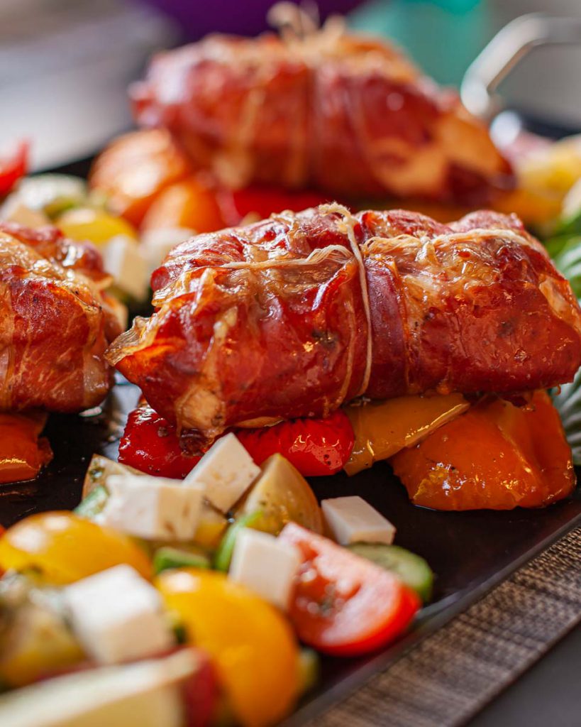 Prosciutto-Wrapped Chicken Breasts with Smoked Bell Peppers and Greek Salad